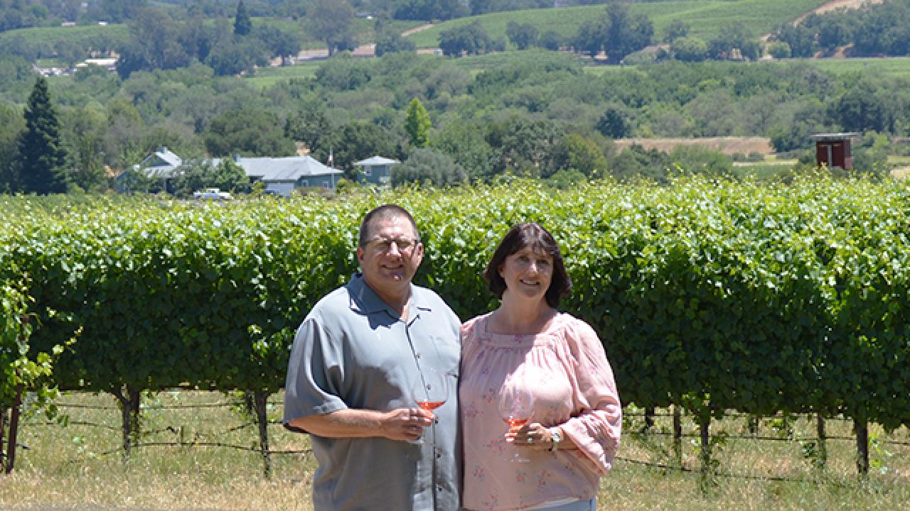 John and Diane Bucher are extremely proud of their organic dairy classification and being recognized as a sustainable viticulture grower, a high-priority initiative by the Sonoma County Wine Grape Commission. John Bucher '84 and his wife Diane of Bucher Wines posing in front of their vineyard