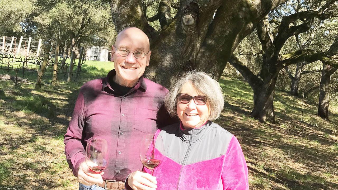 Russell and Bette Russel standing in their vineyard. Russell and Bette Russel standing in their vineyard