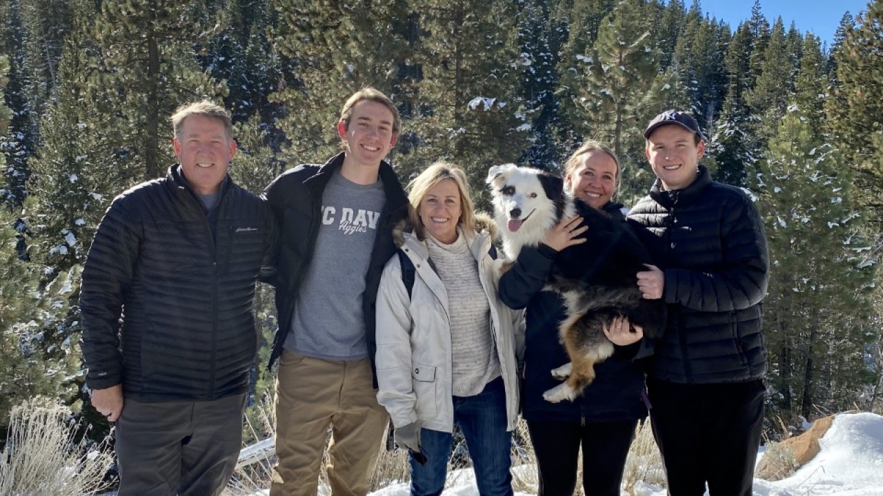 The Sullivans have made philanthropy a family tradition from the time their children were young. (L-R) Pat ‘83 MD ‘87, Riley ‘20, Cecelia ‘83, Kaela ‘12, Sean ’15 and Maizy the dog. Family standing outdoors