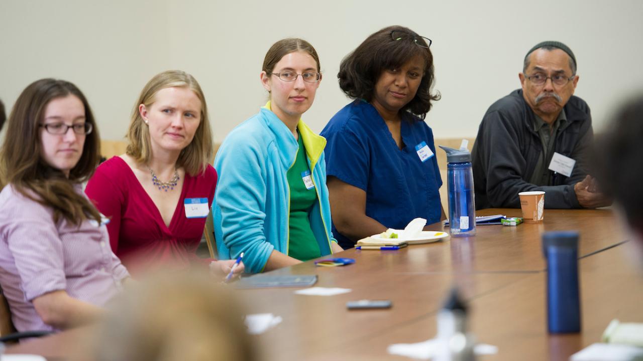 Group of people sitting at long table