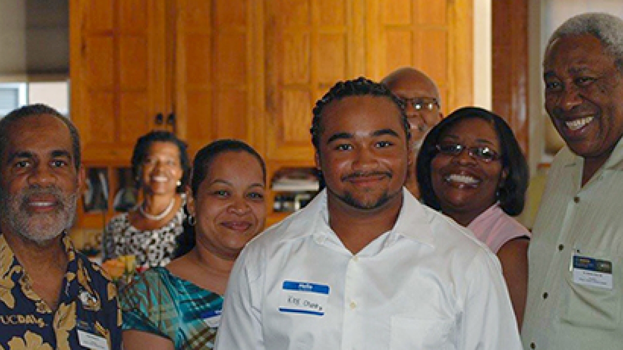 UC Davis freshman Kirk Crump and members of the UC Davis Cal Aggie African and African American Alumni Association (5A). 5A