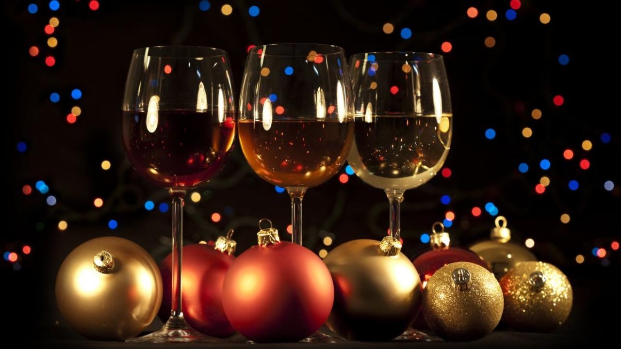 wine glasses with a holiday theme and dark background