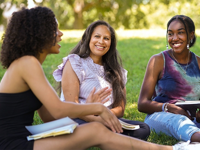 group of women students and alumni engaging in conversation