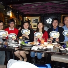 Six people sitting behind a table 