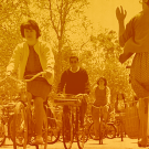 image of people riding on bikes with a golden hue