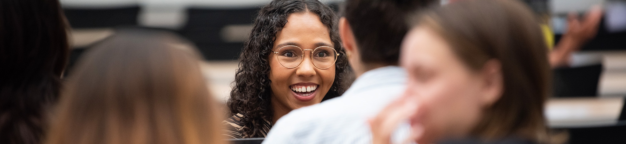 student smiling in engaging conversation